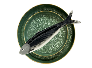 An image of a plate witha. fish on it
